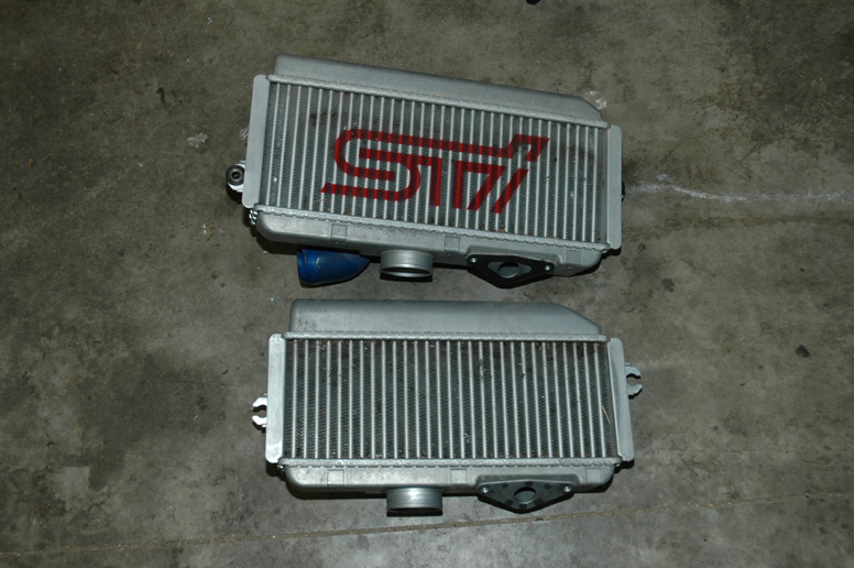 The STI intercooler is larger in every dimension than the stock WRX unit.